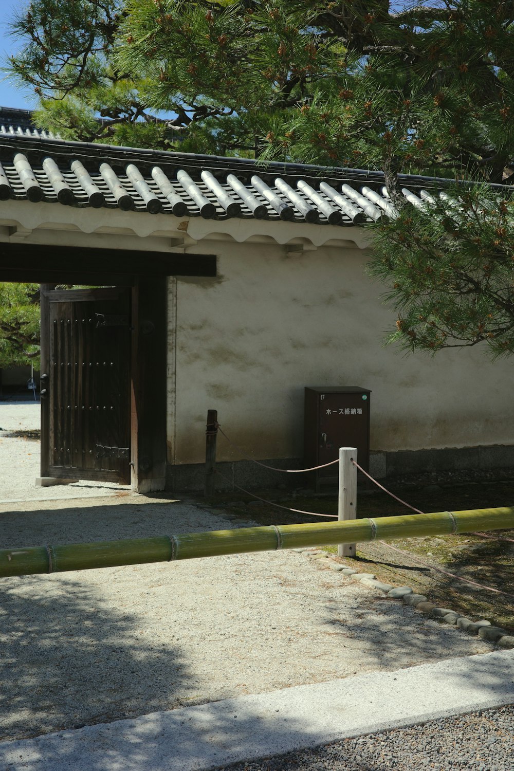 a small building with a fence around it