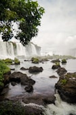 A breathtaking view of a waterfall cascading down rocky cliffs.