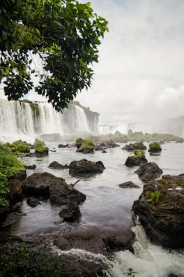 A breathtaking view of a waterfall cascading down rocky cliffs.
