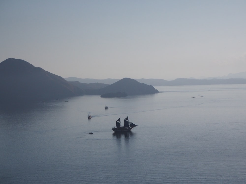 a large body of water with a boat in the middle of it