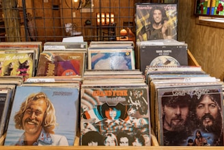 a bunch of cds that are sitting on a table