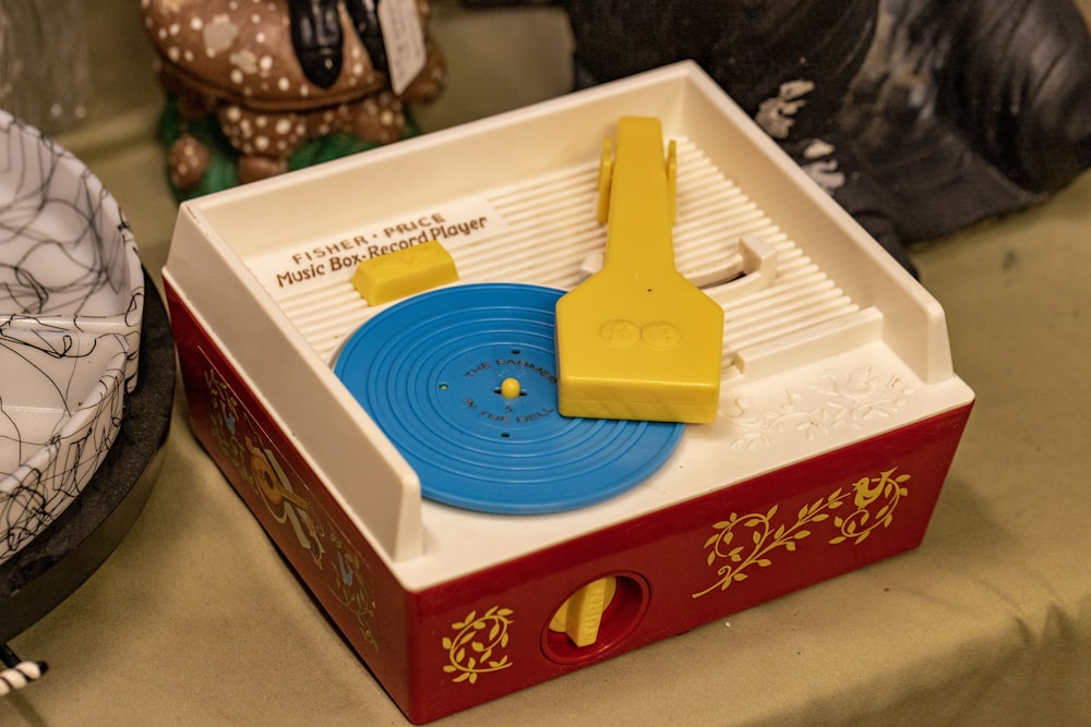 a toy record player sitting on top of a table