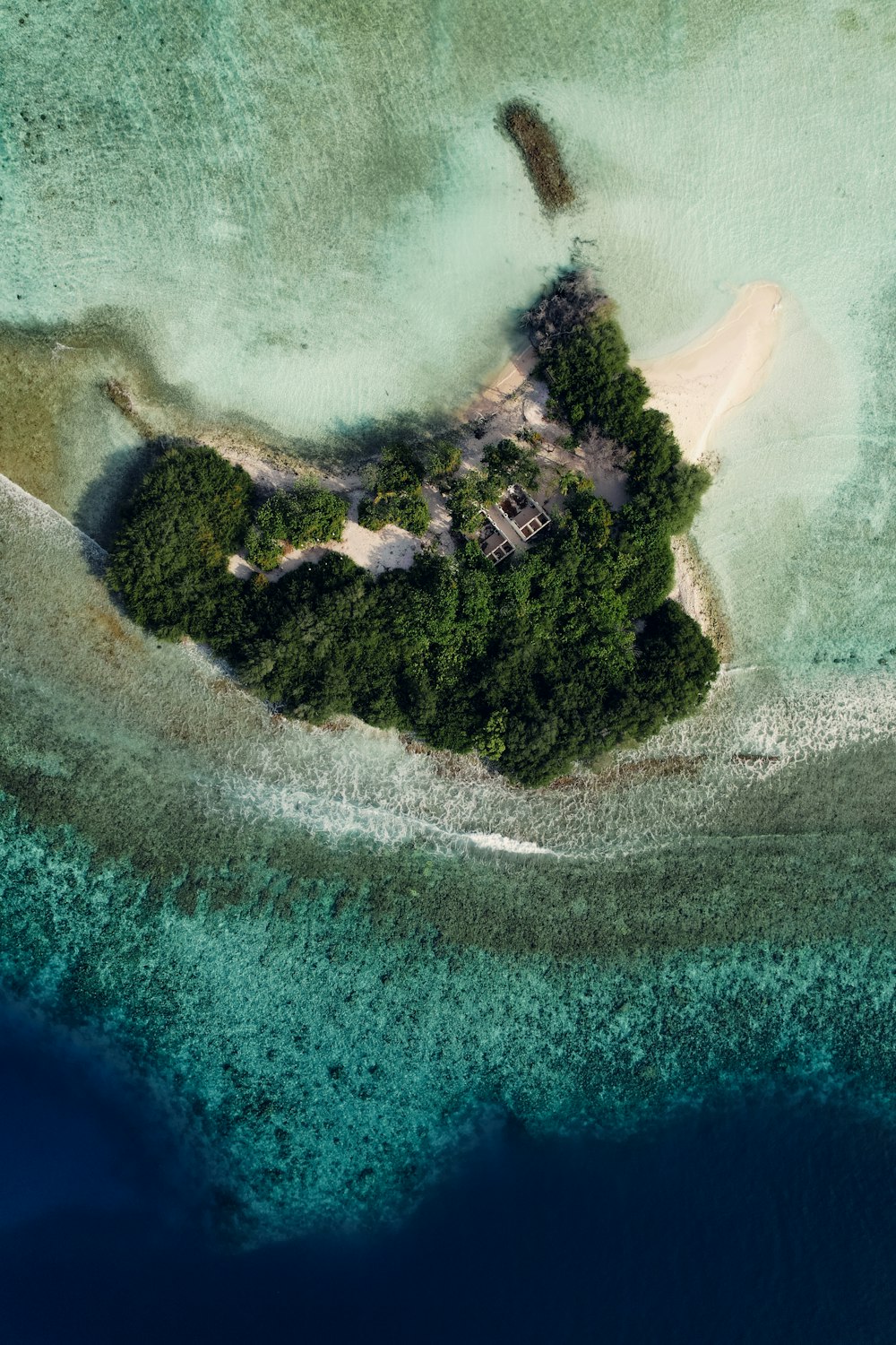 an aerial view of an island in the middle of the ocean