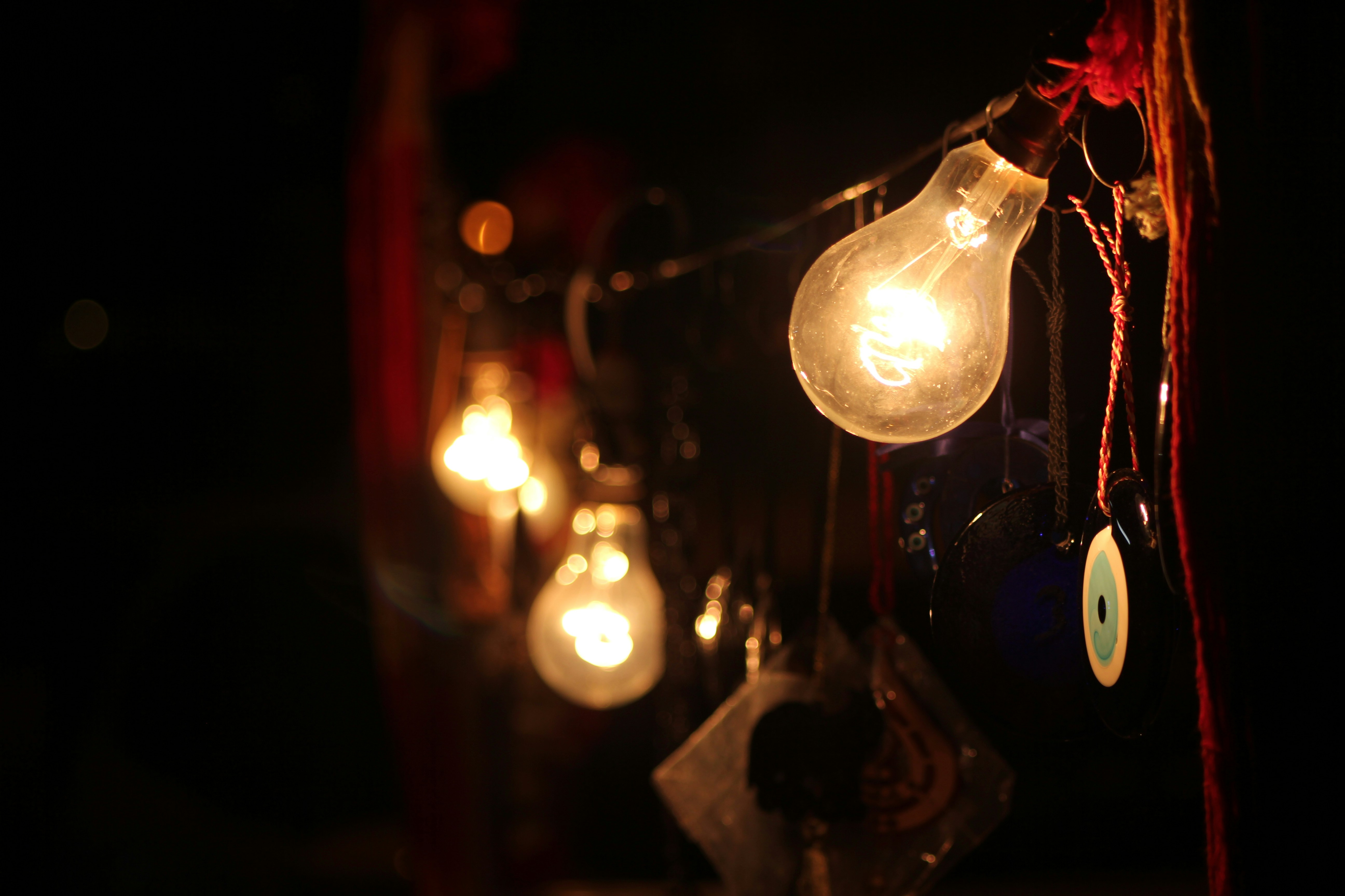 Lights illuminating a stall owned by a simple street vendor.