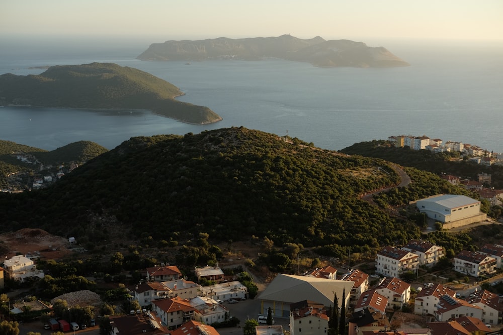 an aerial view of a small town and a body of water