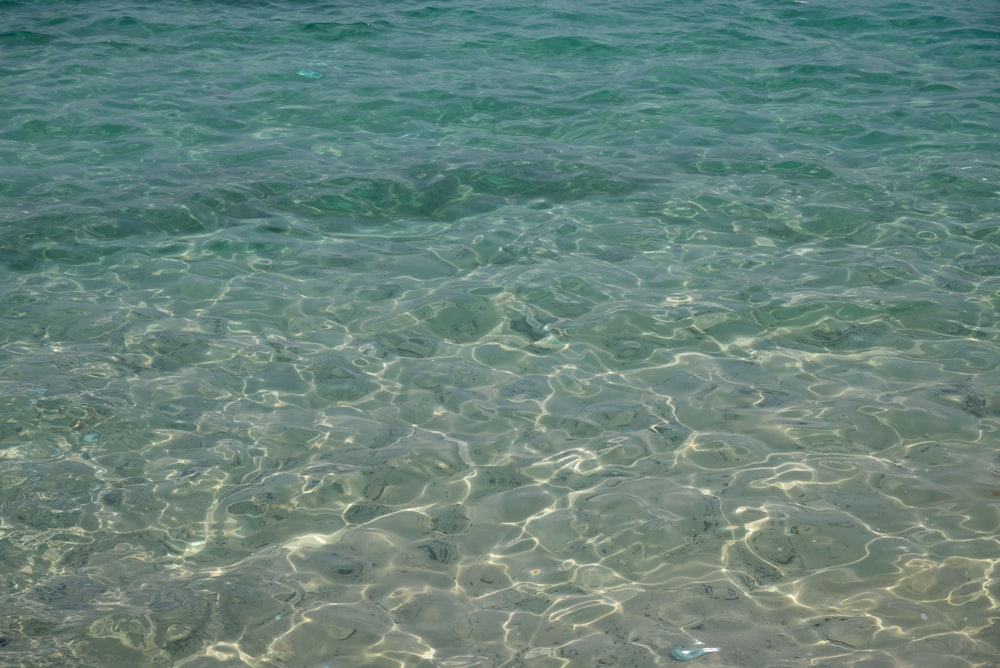 a body of water with a boat in the distance