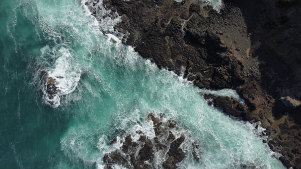A panoramic shot of Isla Isabel’s rocky coastline with waves crashing against the shore.