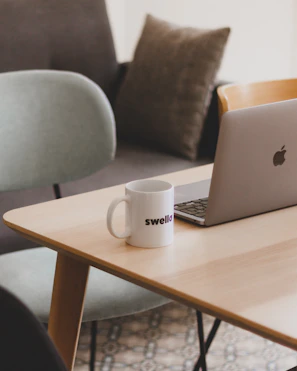 Cozy Scandinavian-style workspace with team planning social media content around a wooden table