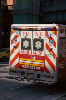 an ambulance is parked on the side of the road