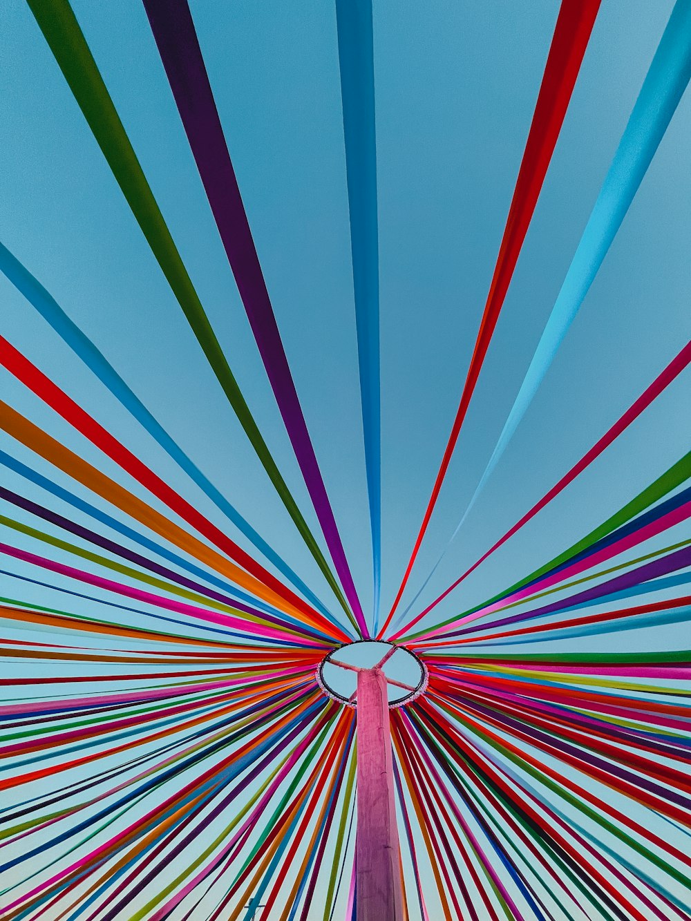 a very tall colorful structure with a sky in the background