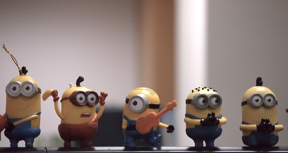 a group of minion figurines sitting on top of a counter