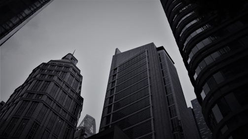 a black and white photo of tall buildings