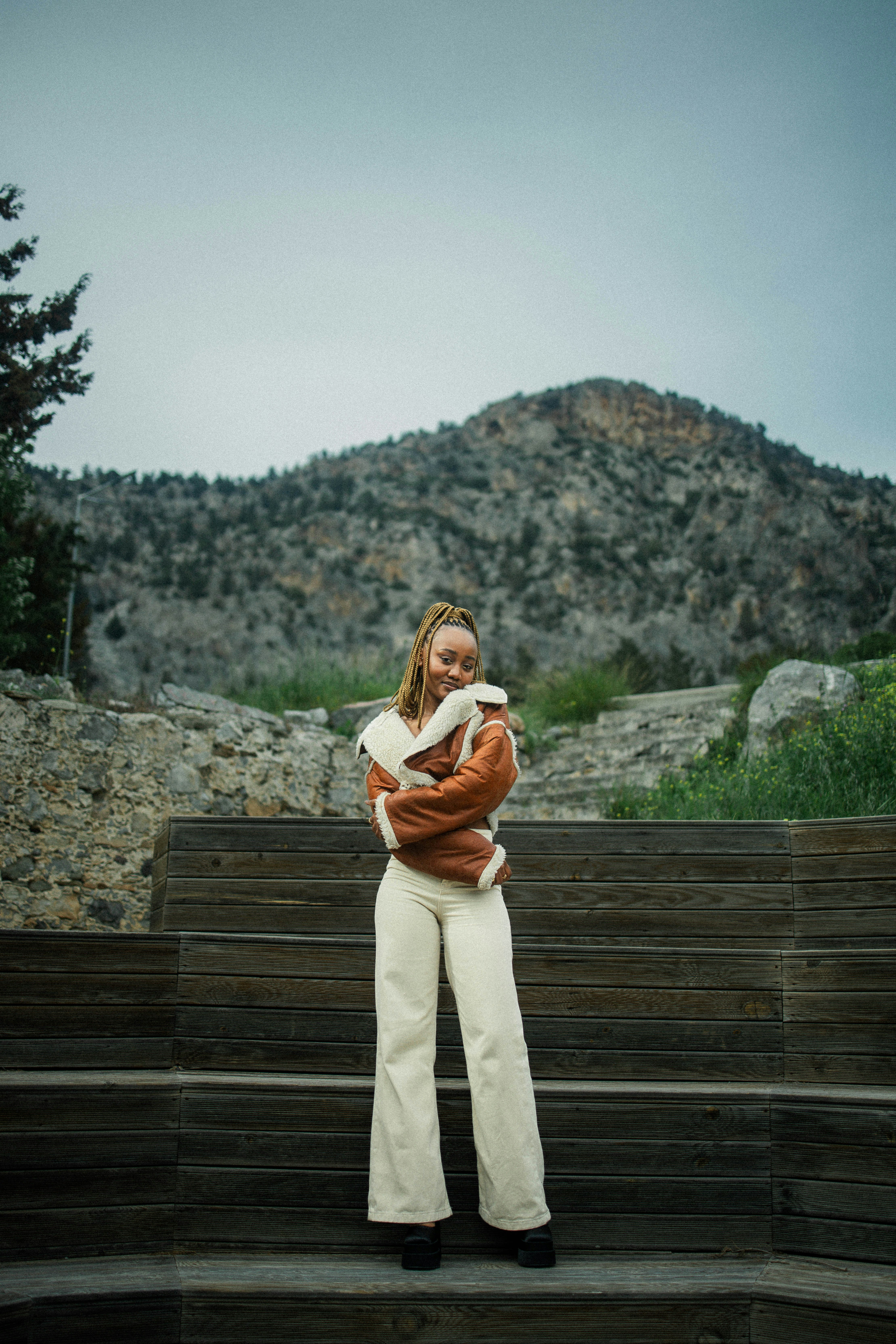 a woman standing in front of some steps