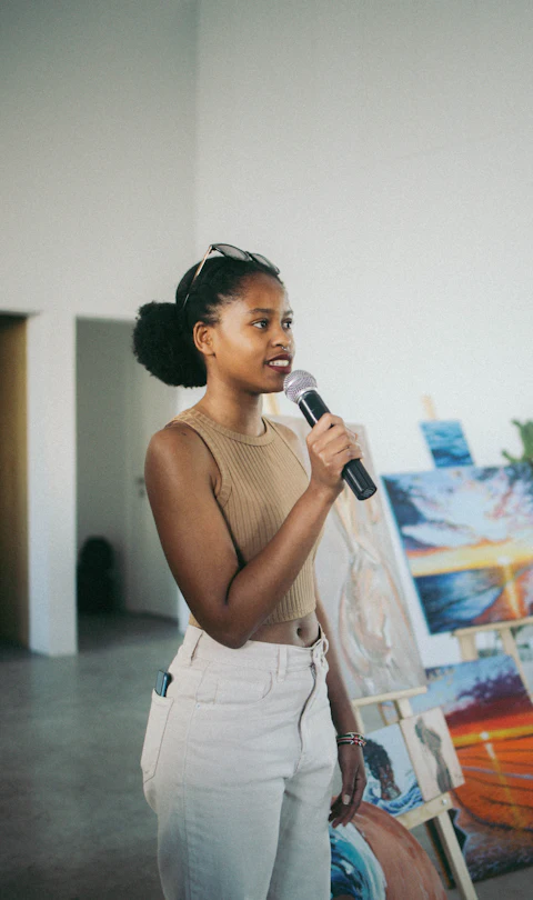 Woman speaking into a microphone