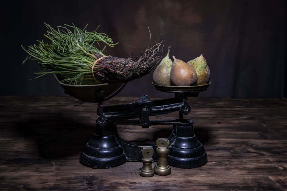 a scale with a bunch of fruit on top of it