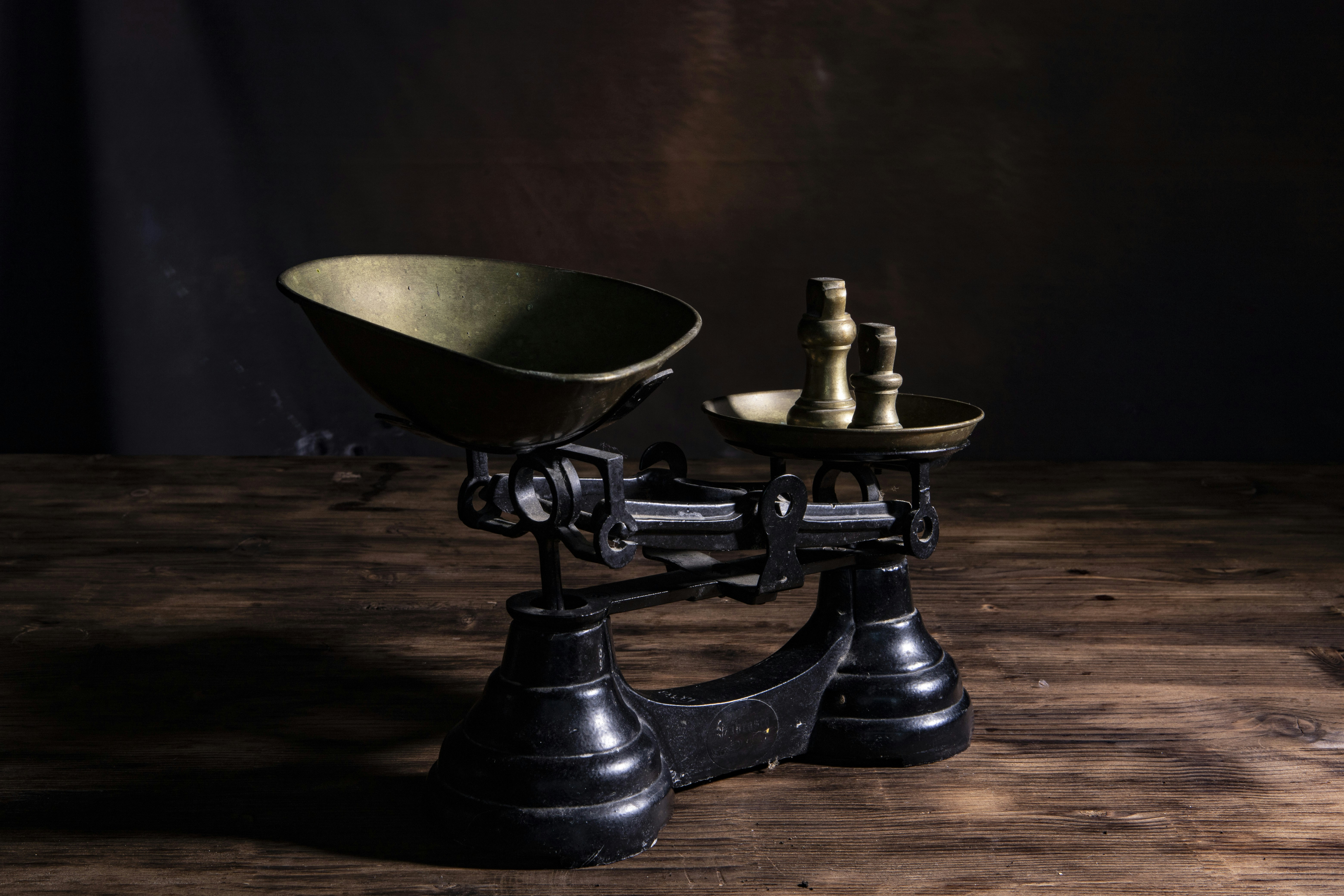 A photograph representing unbalanced brass scale