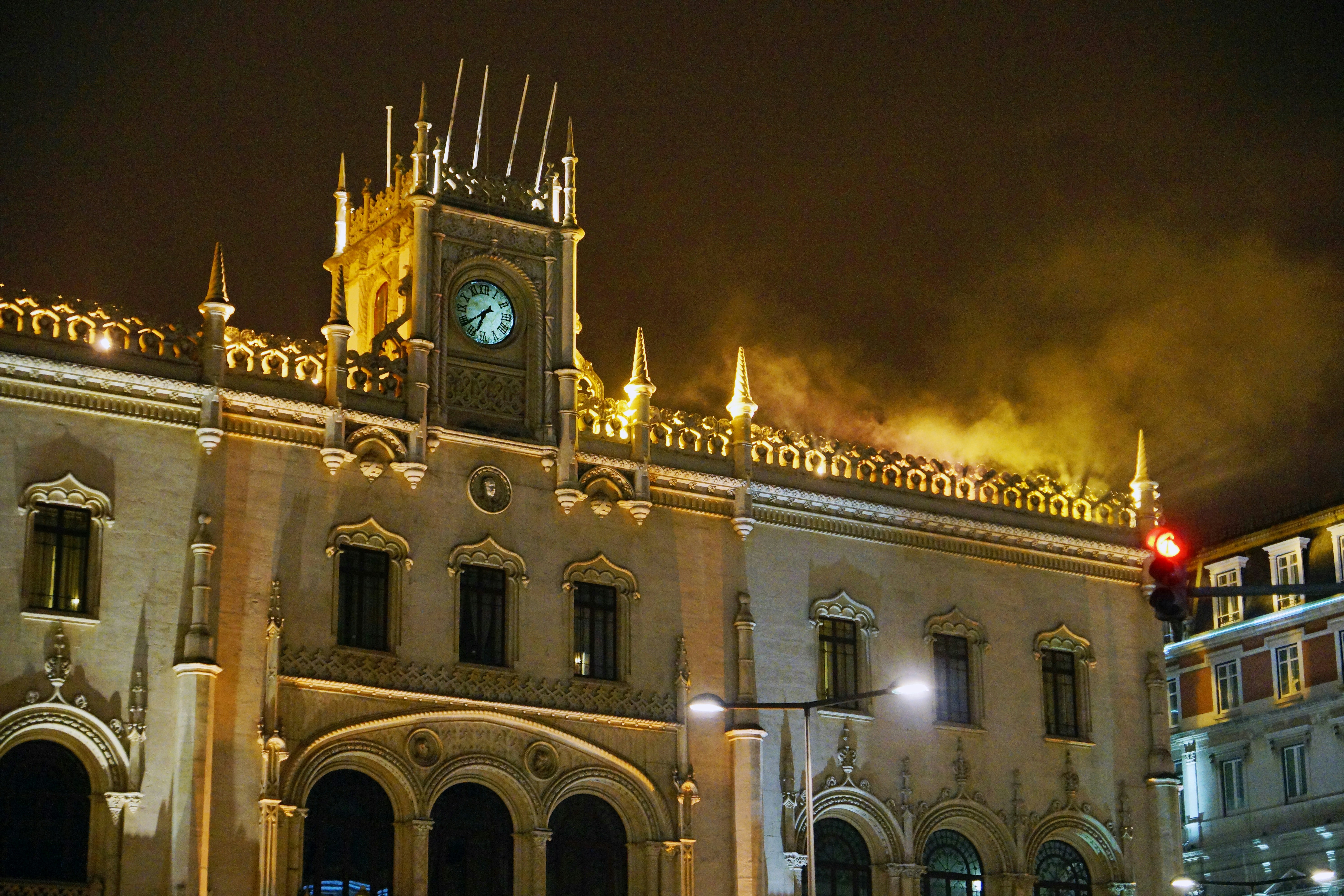 a large building with a clock tower at night