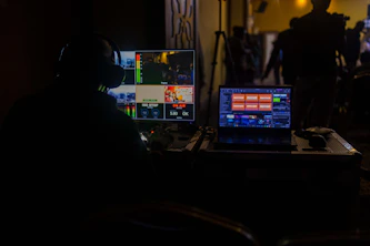 a man sitting in front of a laptop computer