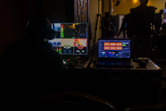 a man sitting in front of a laptop computer