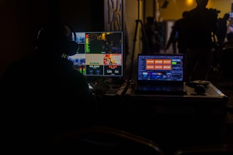 a man sitting in front of a laptop computer