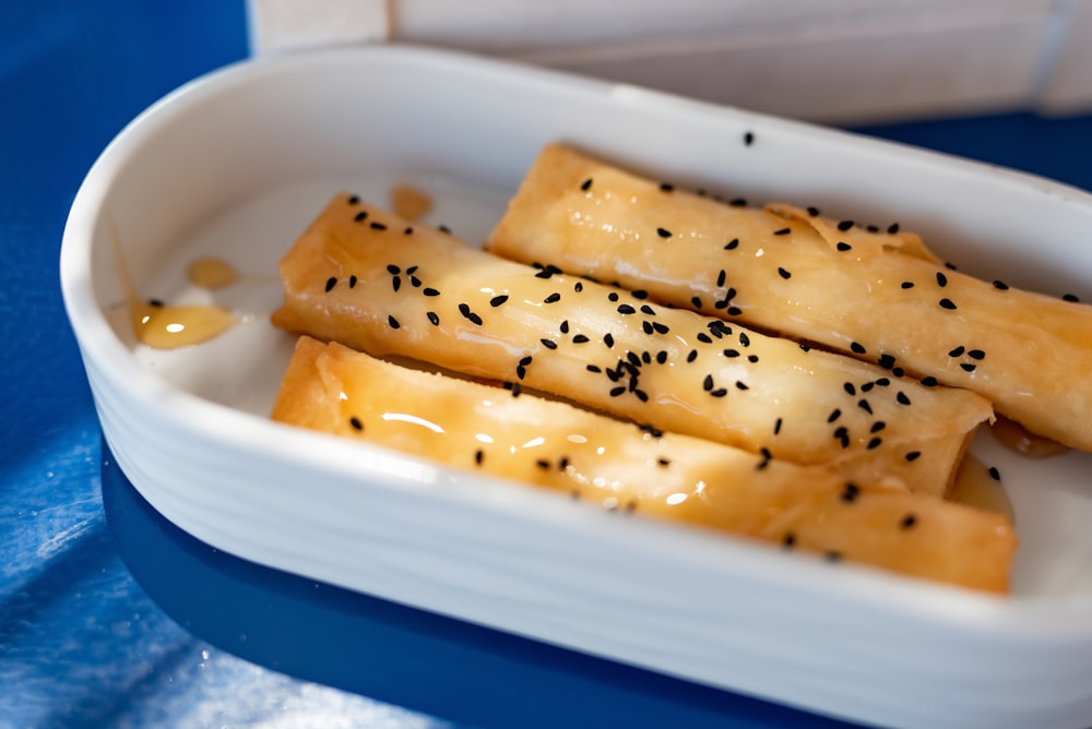 a plate of food with sesame seeds on it