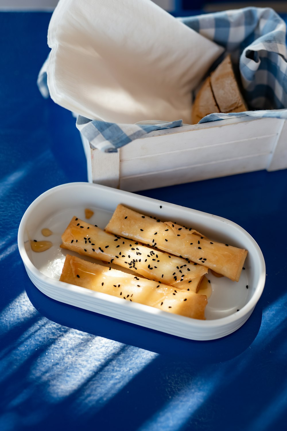 a tray of crackers on a blue table
