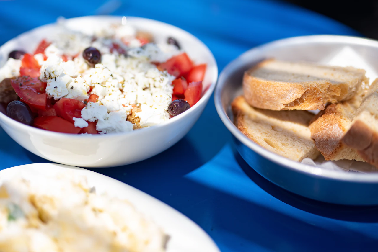 A spread of Greek meze dishes on a table