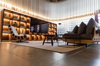 a living room filled with furniture and a large window