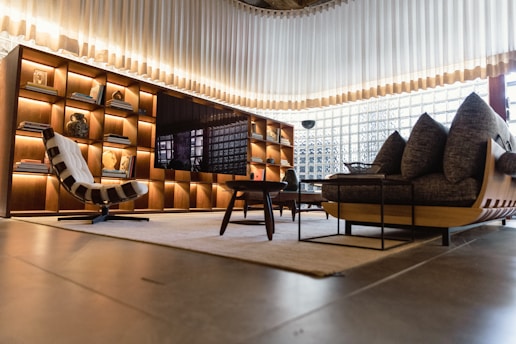 a living room filled with furniture and a large window