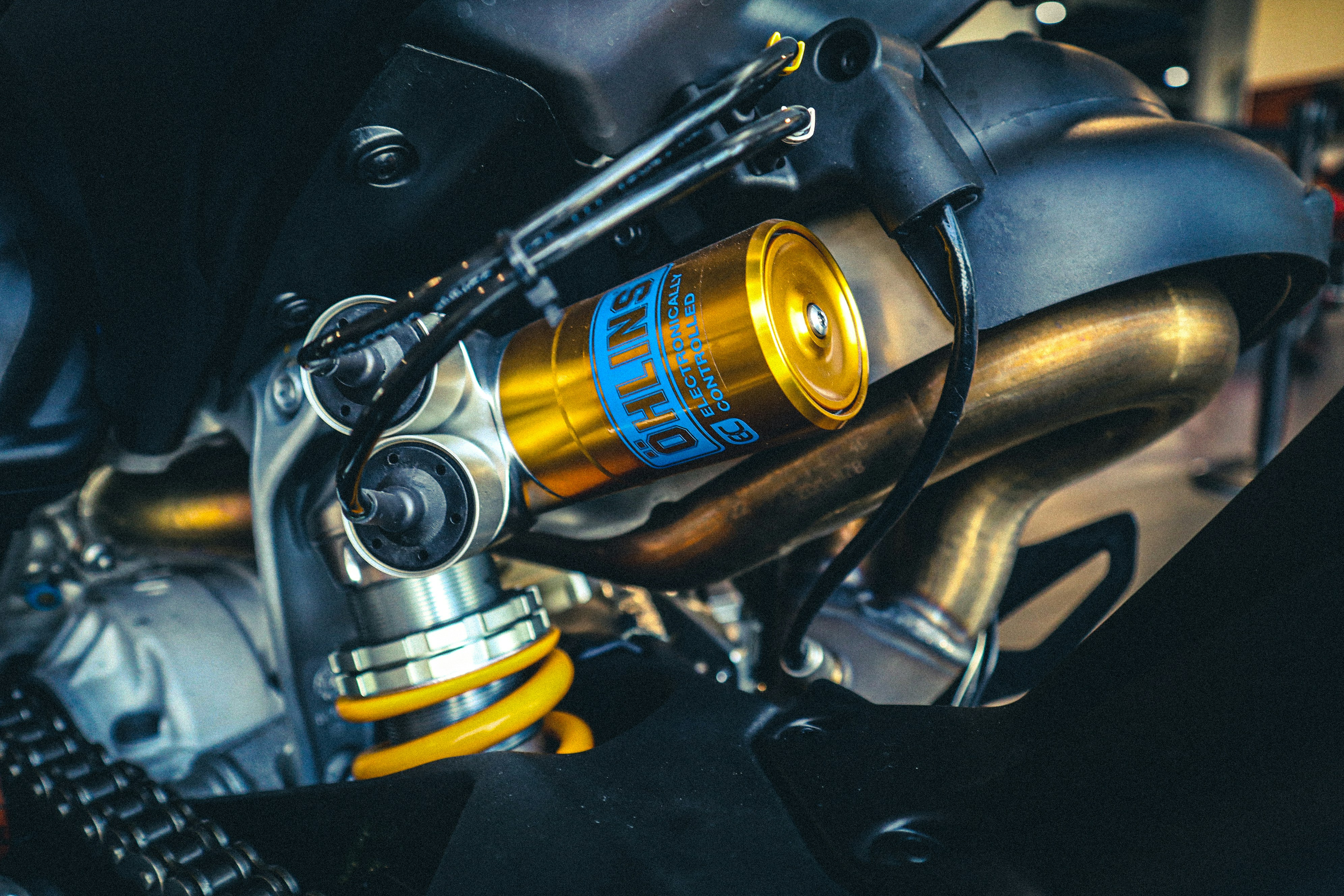 A close up of a motorcycle engine with a yellow cap photo – Free ...