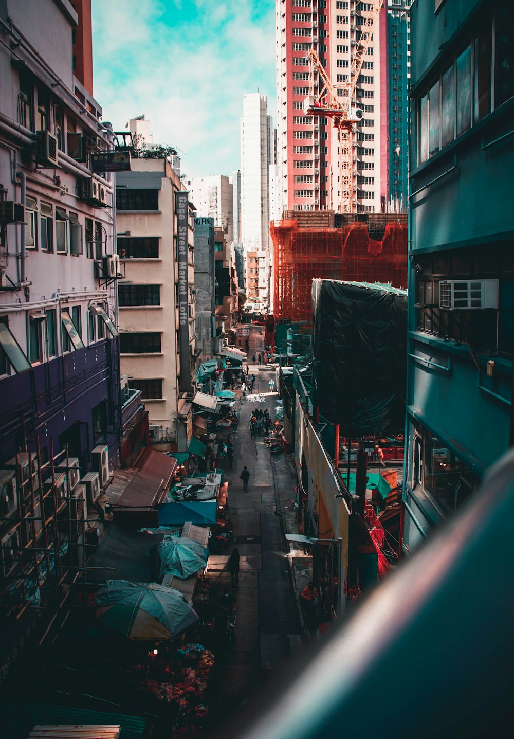 a city street filled with lots of tall buildings