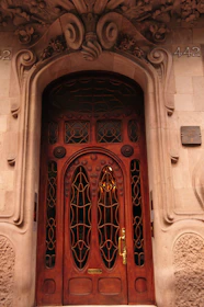 A sturdy wooden door with intricate designs, highlighting Portaviva's attention to detail.