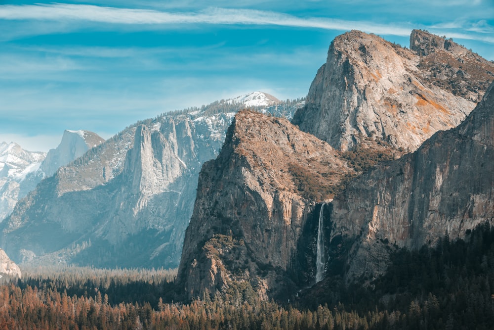 a mountain range with a waterfall in the middle of it