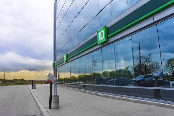 A sleek, modern office lobby with black, gold, and white accents reflecting TDJ Global's elite branding.