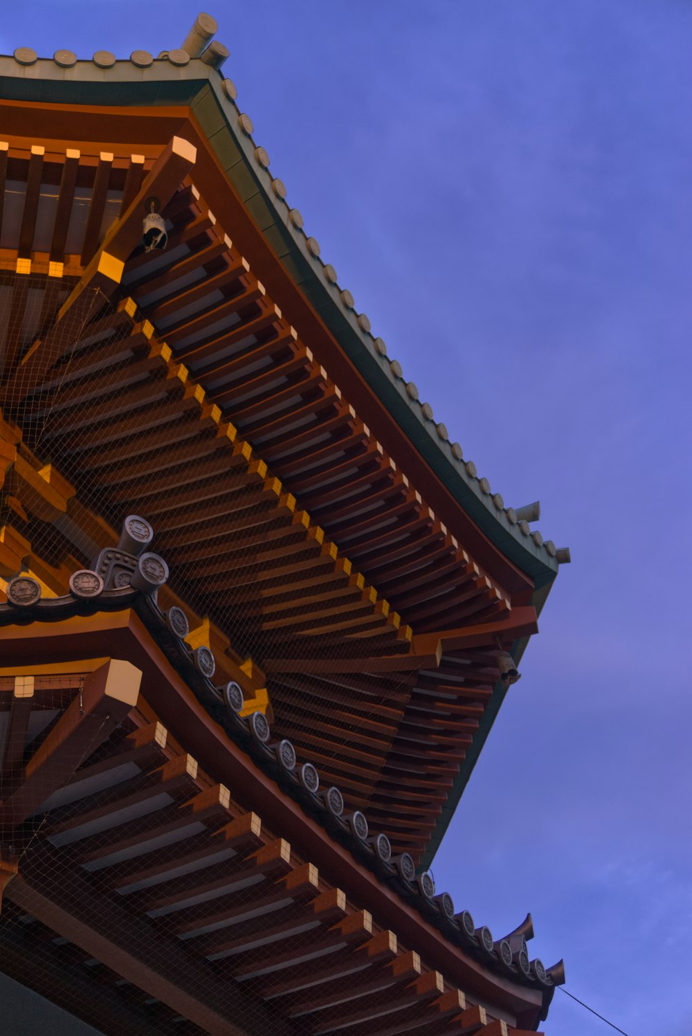 a tall building with a sky in the background