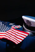 an american flag laying on top of a uniform