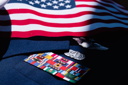 a close up of a tie with a flag in the background
