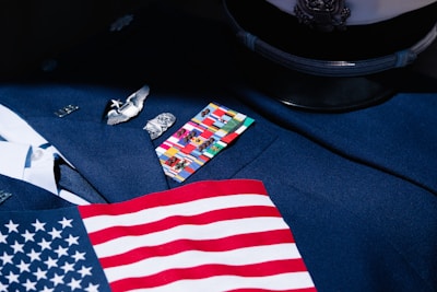 a close up of an american flag on a suit