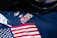 a close up of an american flag on a suit