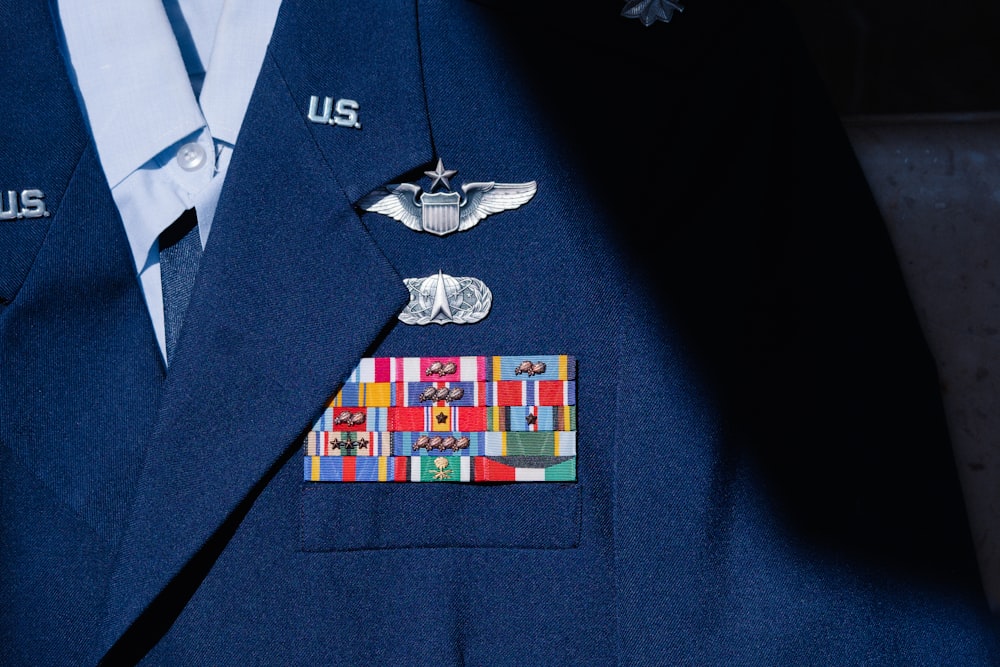 a close up of a suit with a medal on it