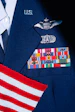 a close up of a uniform with a flag