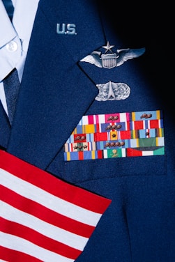 a close up of a uniform with a flag