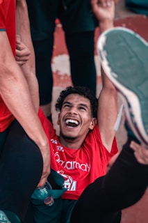 Bryan smiling with friends after a successful day balancing school and sport.