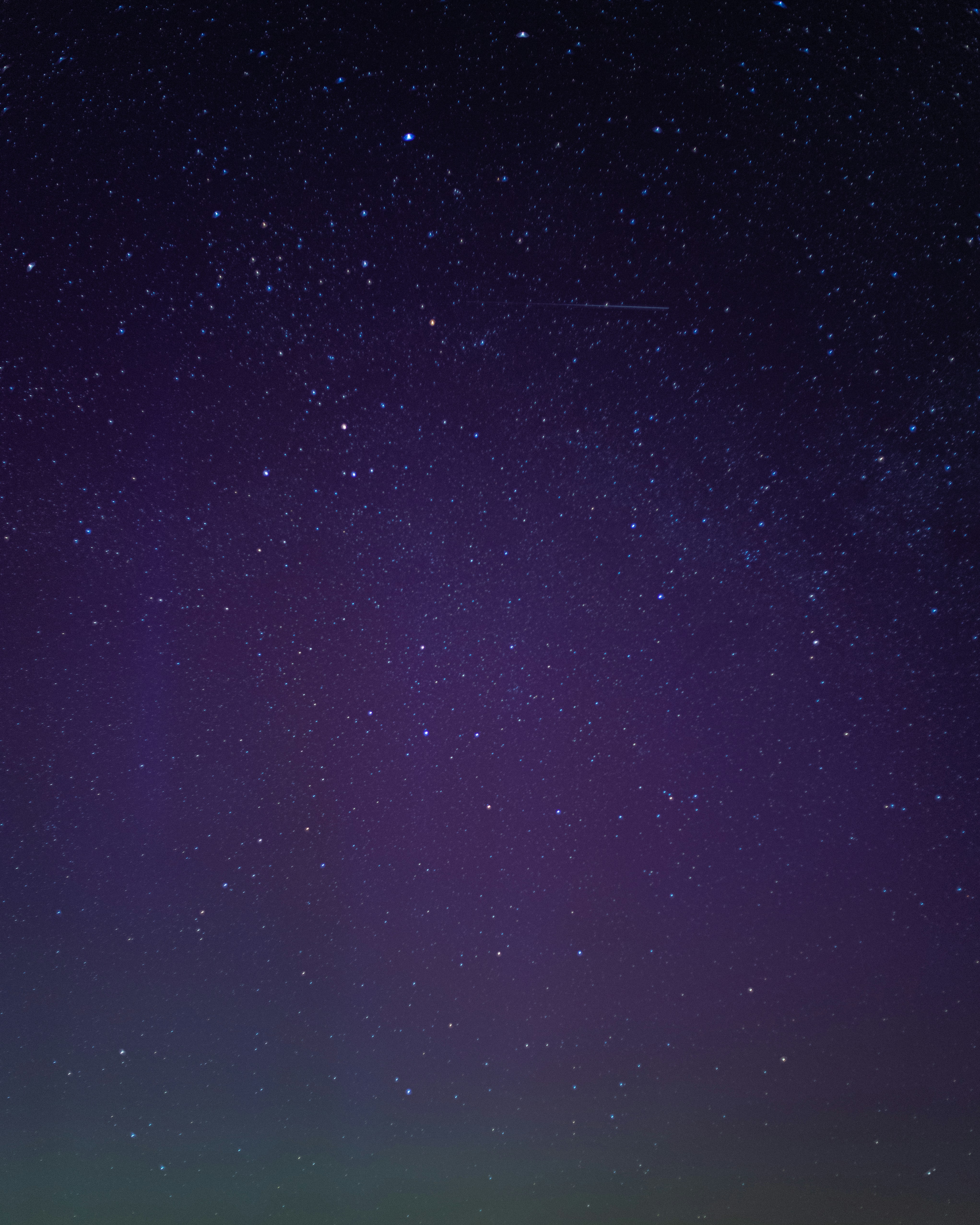 woman wearing yellow long-sleeved dress under white clouds and blue sky during daytime