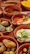 Close-up of a colorful assortment of Lebanese mezze beautifully arranged on rustic dishes.