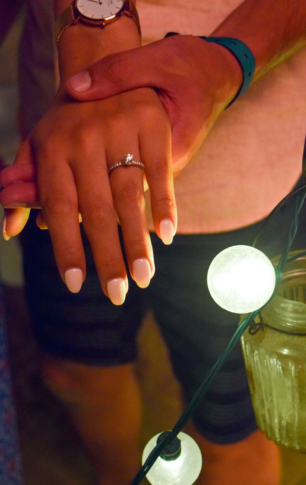 a close up of a person with a ring on their finger