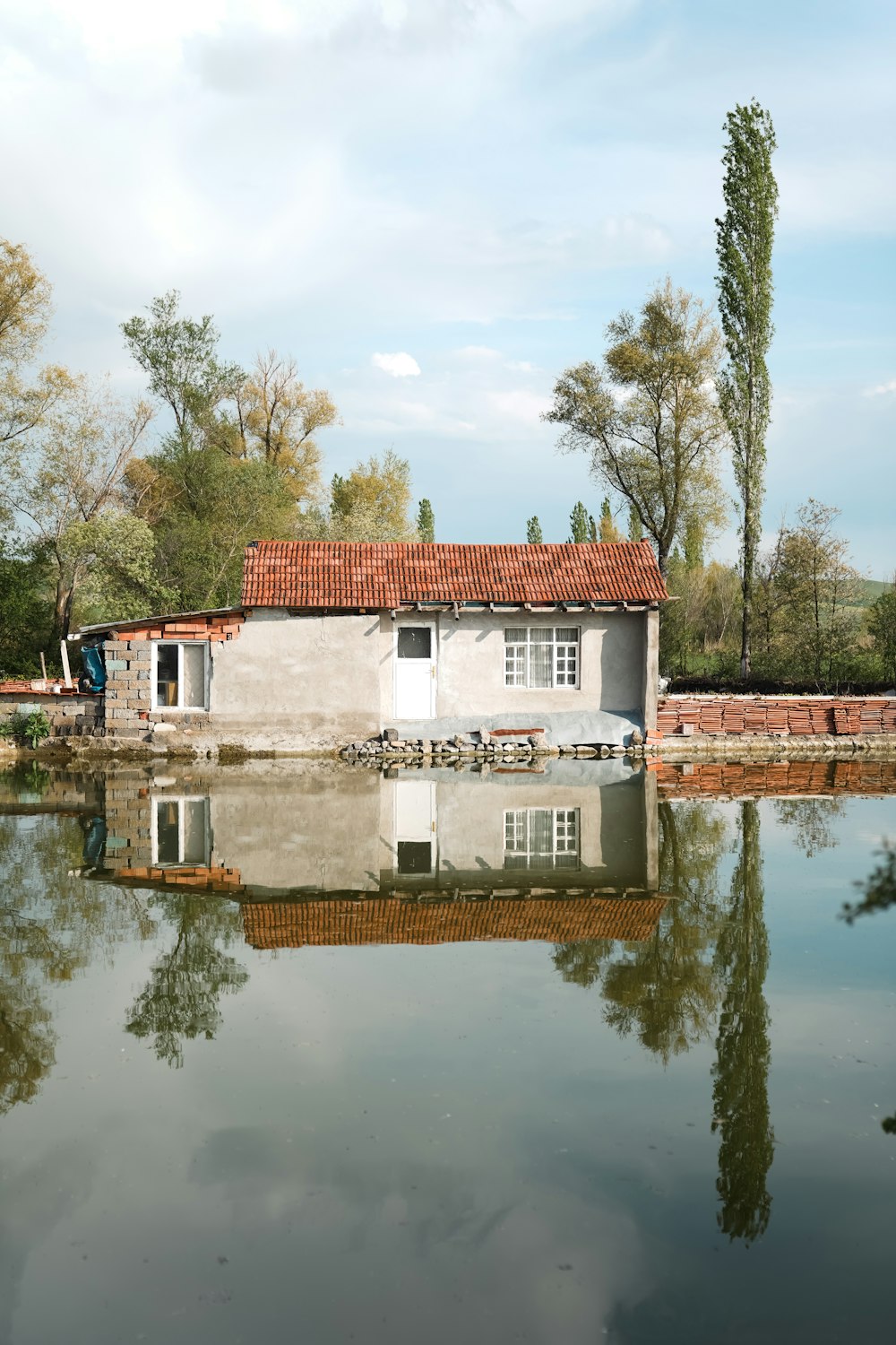 a house sitting on top of a body of water