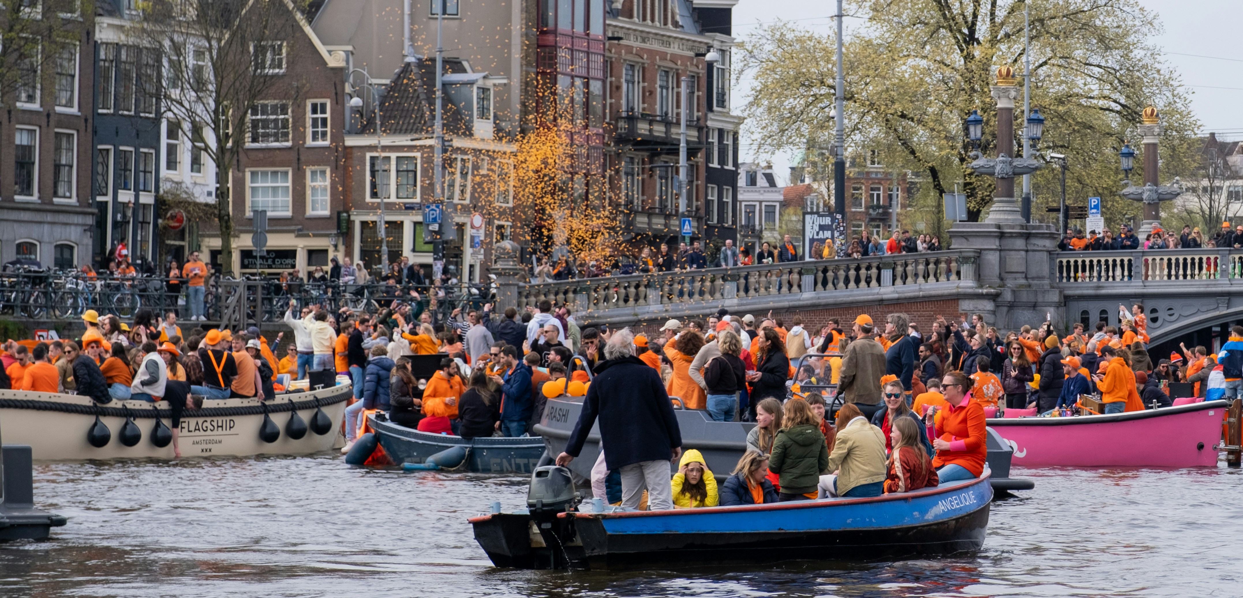 a large group of people in boats on a river