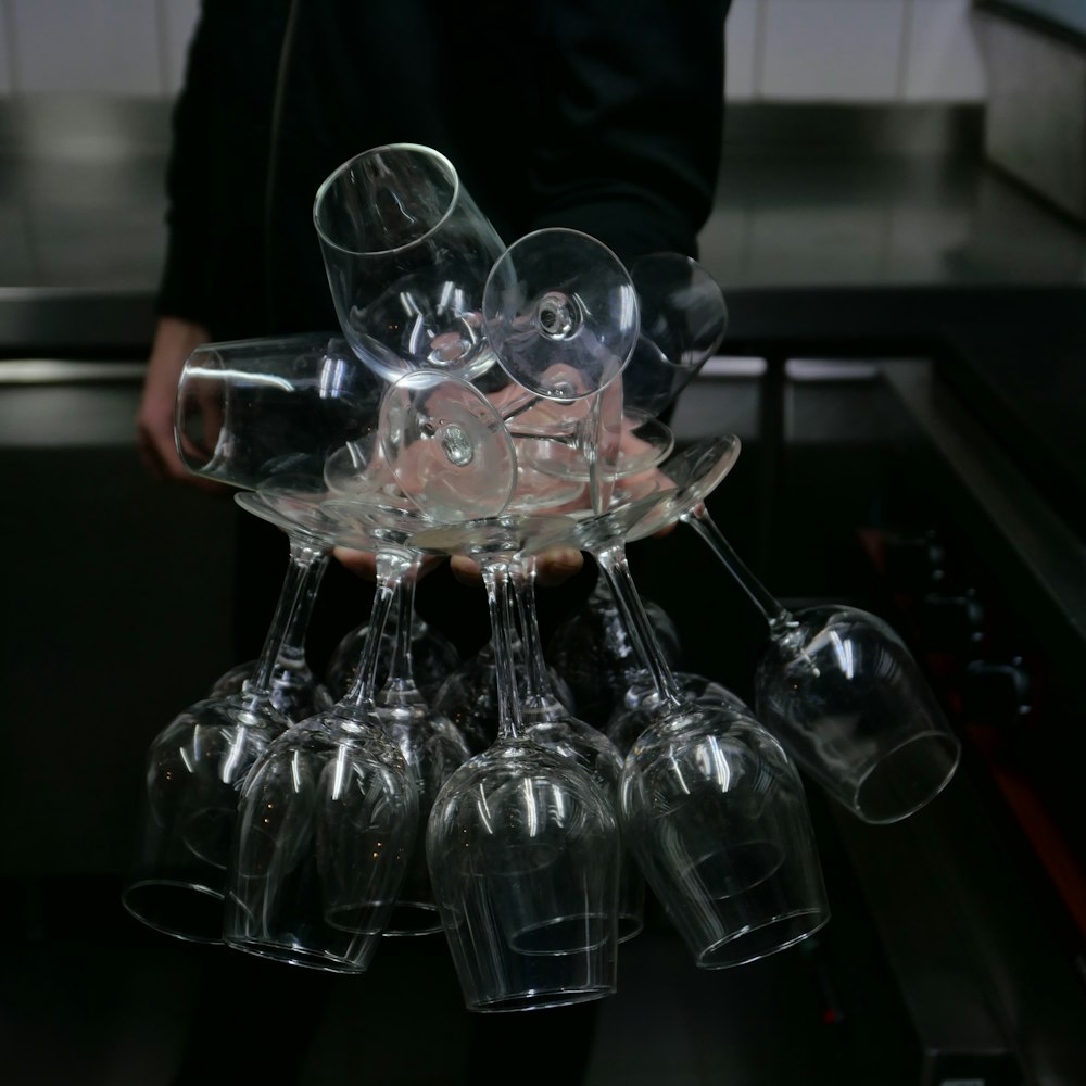 a bunch of wine glasses sitting on top of a table