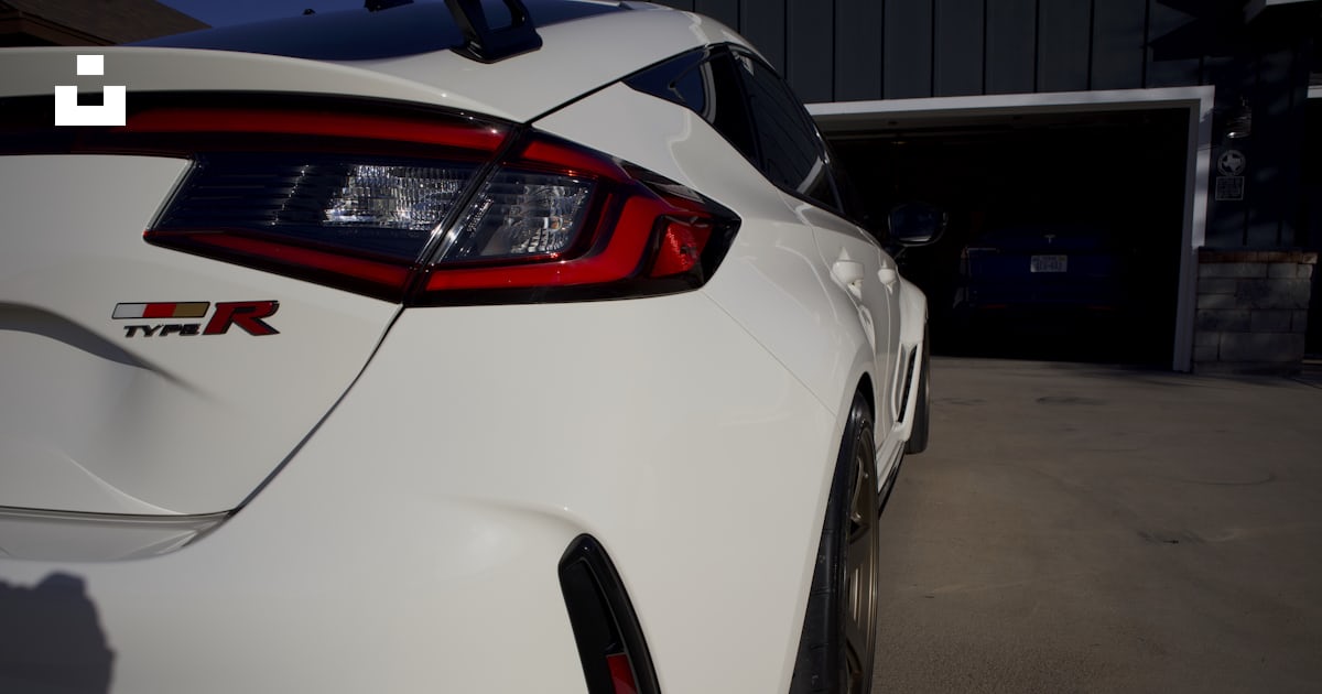 The rear end of a white car parked in a garage photo – Free #civictyper ...